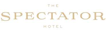 The Spectator Hotel logo on black background.
